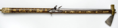 An ornate flintlock pistol/axe combo weapon, originates from Silesia, 18th century.