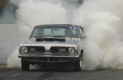 exitthedragon:  enginedynamicsinc:  Adam smokin’ up his Cuda @ NorthWest Nationals, Seattle   Mopar…