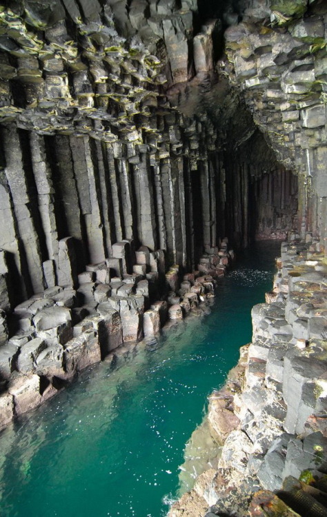 flowing-more-freely-than-wine:Fingal’s Cave, UK “Its size and naturally arched roof, and the eerie sounds produced by the echoes of waves, give it the atmosphere of a natural cathedral. The cave’s Gaelic name, An Uaimh Bhinn, means ‘the melodious