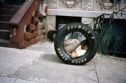 oldnewyork:  Boy in a Tire, Bushwick, Brooklyn, NY, 1984, Meryl Meisler (source) 