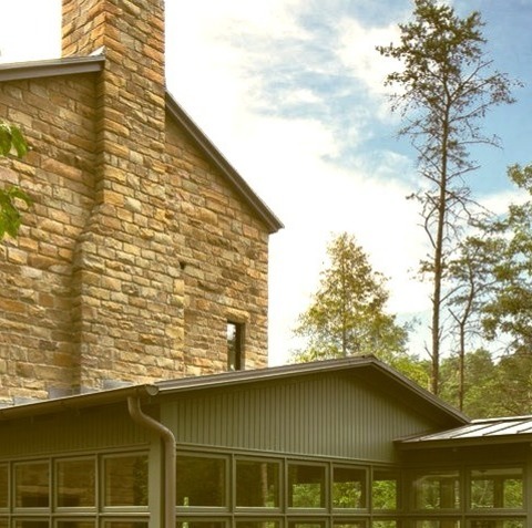 Exterior - SidingLarge Country Brown Three-story Mixed Siding House Exterior Photo With A Clipped Gable