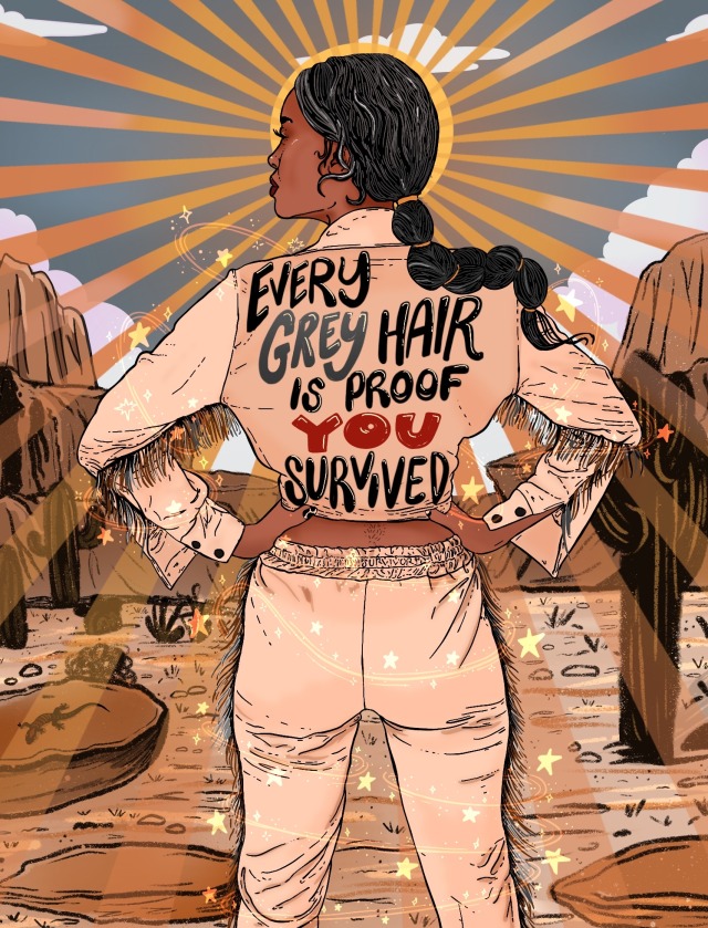 Digital illustration of the back of a brown fem with a long ponytail. Their hair is black with grey streaks, and they’re wearing a beige 2-piece jumpsuit that has fringe. The back of their jacket reads ‘every grey hair is proof you survived.’ The background is a desert scene. 