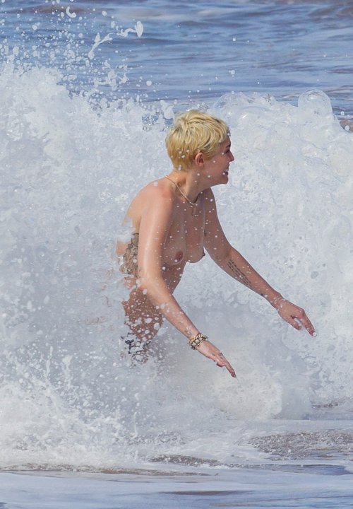 hotcelebshd:  Miley Cyrus Topless in Hawaii HQ Pictures ALL PICTURES: Click 