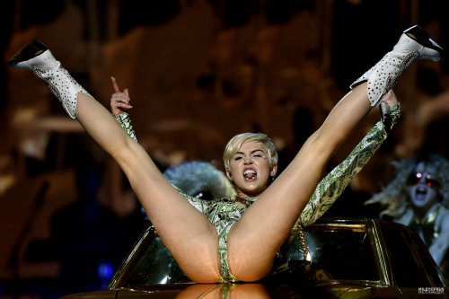 pornwhoresandcelebsluts:  Miley Cyrus does more slutty spread leg crotch shots live in concert on the Bangerz tour