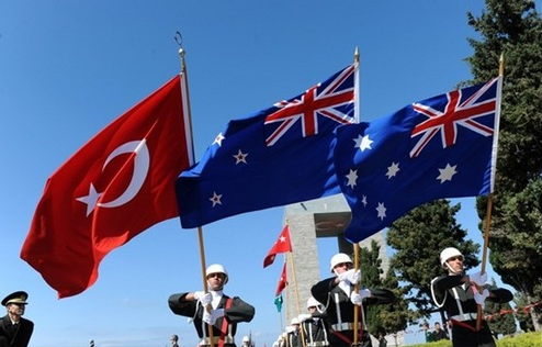 Turkish troops carry the Turkish, New Zealand and Australian flags at an ANZAC Day ceremony at Gallipoli.
[ANZAC Day / Aussies at War]