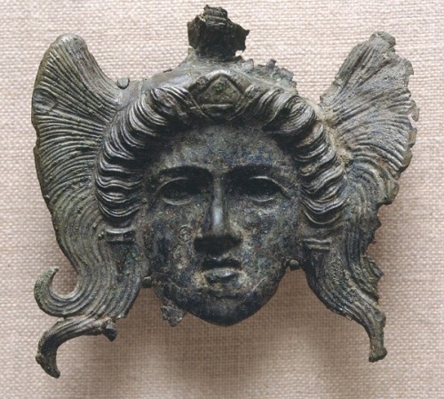 centuriespast: Unidentified Artist Female Head in Relief, 300-100 BCE Bronze 3 5/8 x 3 11/