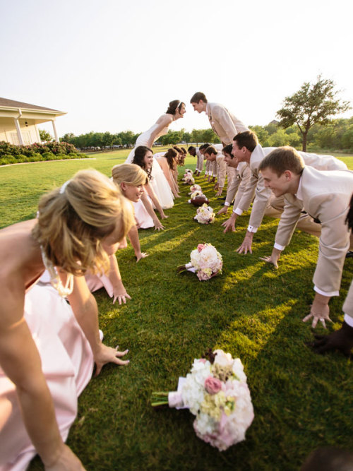 This football-loving bridal party enjoyed some friendly competition during their photo session! Phot