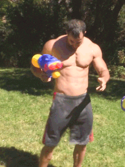 bulge2go:  bruderfusse2:  I’d like to be chased around by him, his water gun, and his other gun.  And I’d like him to shoot me with the latter.  Wiggle wiggle wiggle. 