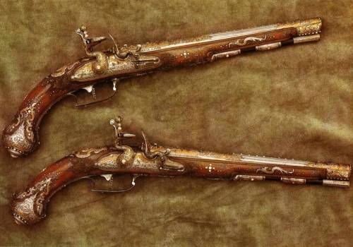 A pair of ornate flintlock pistols from Suhl, Germany, dated 1741from The Dresden Armory