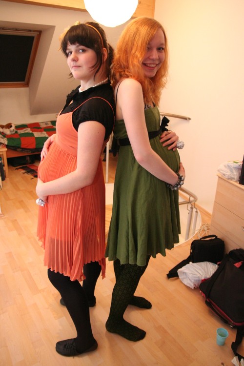 Two pregnant Fashion Queens wearing maternity tights.