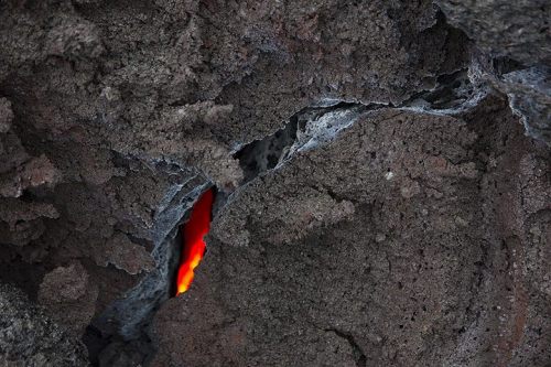 Cooling lava One should always beware when walking over a freshly erupted lava field, as one never k