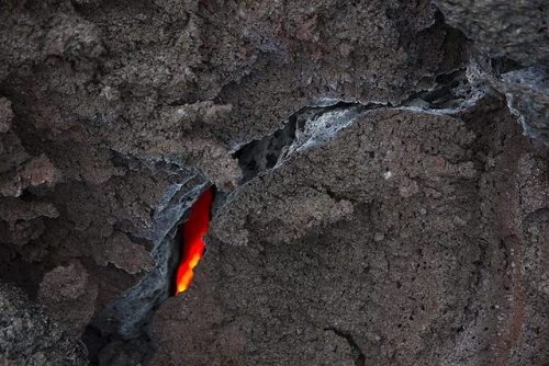 Cooling lavaOne should always beware when walking over a freshly erupted lava field, as one never kn