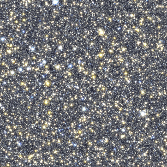 Many thousands of bright stars speckle the screen. The smallest ones are white pinpoints, strewn across the screen like spilled salt. Larger ones are yellow and bluish white with spiky outer edges like sea urchins. Credit: Matthew Penny (Louisiana State University)