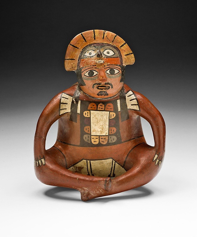 ~ Vessel in the Form of a Seated Ruler.
Date: 180 B.C.-A.D. 500
Culture: Nazca
Place of origin: South coast, Perú
Medium: Ceramic and pigment