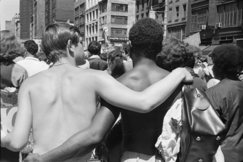 vintageeveryday:  A pair of shirtless men walking arm in arm during the first Stonewall anniversary march, New York, June 1970. Photograph by Fred W. McDarrah.