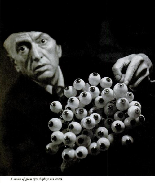 zoomar:
“ A maker of glass eyes displays his wares
”