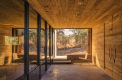 archatlas:  Lavacrete House in Arizona Casa Caldera by DUST is a 945 square foot shelter located on the southwestern bajada of the Canelo Hills in Southern Arizona’s San Rafael Valley. The structure emerges from the native grasses that define the hillside