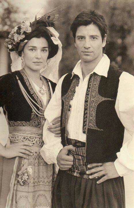 Maria Nafpliotou and Sakis Rouvas in traditional costumes for the island of Corfu, Greece