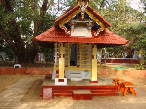 Theyyam temple, looking inside the sanctuary one can see the swords that represent the Goddess Bhaga