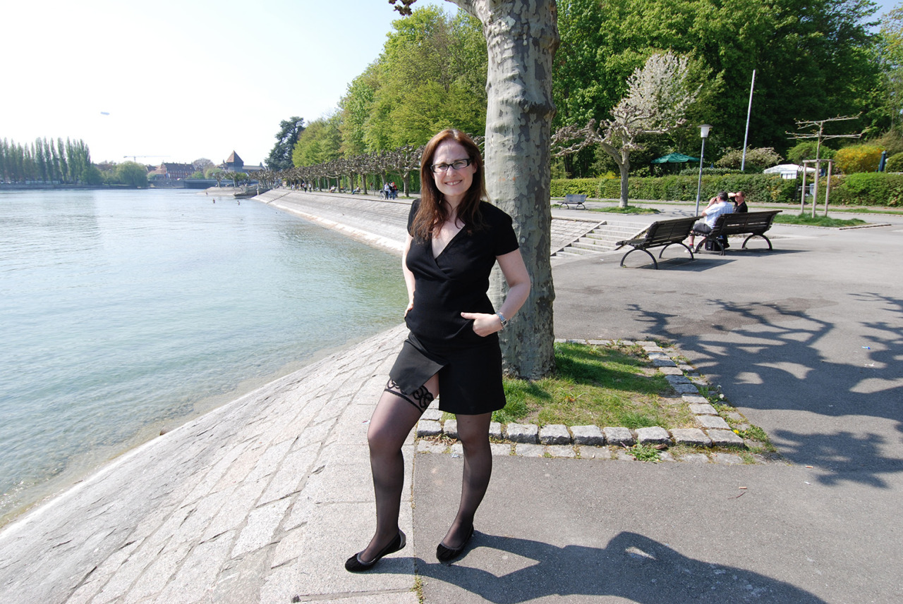 lustfulsabine:  Just outside in a black dress and stockings