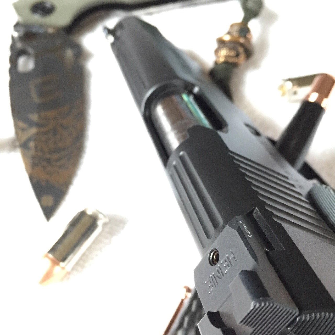 gunsknivesgear:  Nighthawk Custom Falcon Commander 45 acp. Strider frame lock knife.