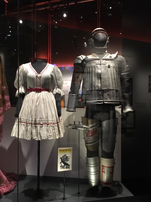 Dorothy&rsquo;s dress and The Tin Man&rsquo;s costume from The Wiz.