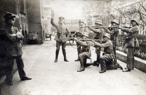 A German Communist crosses his arms and stares at his firing squad, moments before he is executed. 1