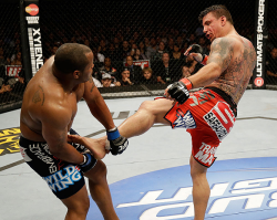 rearnakedchoking:  Daniel Cormier catches a kick by Mir. Cormier eventually won the bout by unanimous decision. 