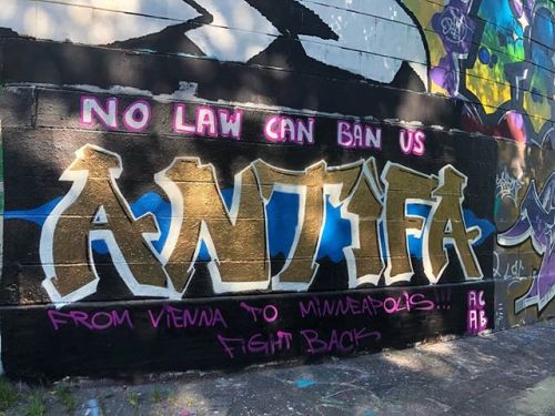 “No law can ban us  / ANTIFA From Vienna to Minneapolis… Fight Back”Seen in Vienna, Austria