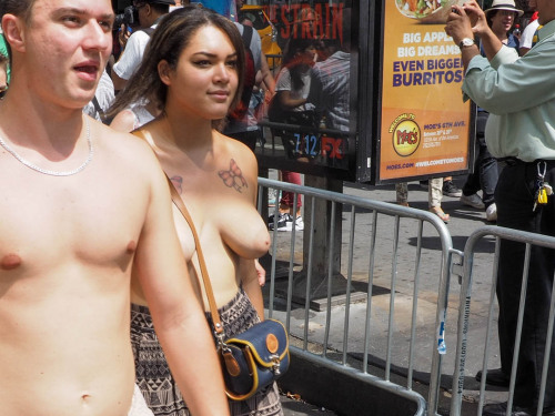 Woman shows pride in support of Time Square’s Painted Ladies (desnudas) in Manhattan’s 2015 Go Tople