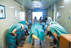 dangnikki: fakhrafakhra:  stunningpicture:  Chinese doctors bowing down to an 11 year old boy diagnosed with brain cancer who managed to save several lives by donating his organs to the hospital he was being treated shortly before his death.  This should