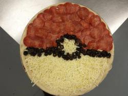 insanelygaming:  Happy Thursday! I hope this Pokemon Pizza makes you hungry.  Well, the meat side would be mine. My girlfriend can have the cheese side.