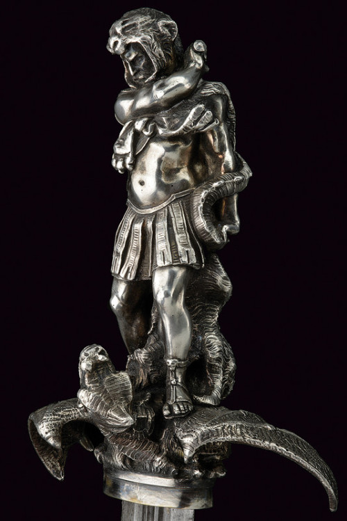 art-of-swords:  “Heroic Style” Silver Mounted DaggerDated: 19th centuryCulture: EuropeanMeasurements: height 64cmThe dagger has a straight, double-edged blade with three fullers. The massive, silver hilt has its the grip worked as the in-the-round
