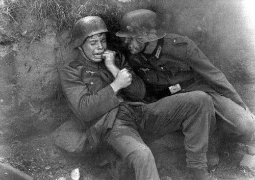 plmq:rafsimonsicarussurgit: A young German boy soldier crying in fear while being yelled at by an of