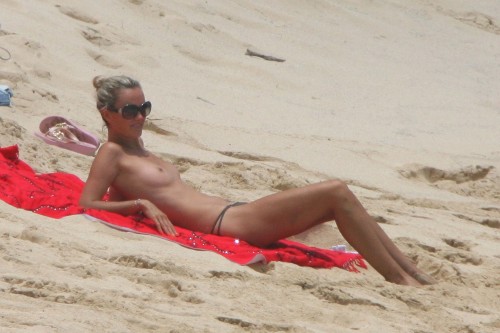 toplessbeachcelebs:  Laeticia Hallyday (Model) sunbathing topless on the beach (August 2009) 