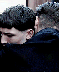 colonel-flag:  Graves pulls Credence into a hug, which, with his hand on Credence’s neck, seems more controlling than affectionate. Credence, overwhelmed by the seeming affection, closes his eyes and relaxes slightly.