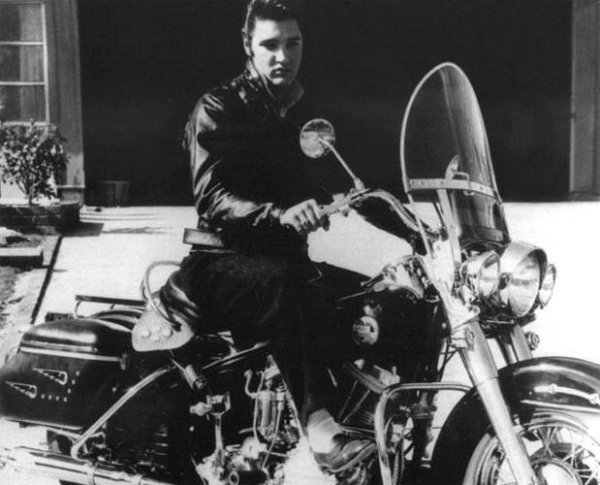 lovingelvisaaron:  Elvis on his new 1957 Harley-Davidson FLH in the rear driveway