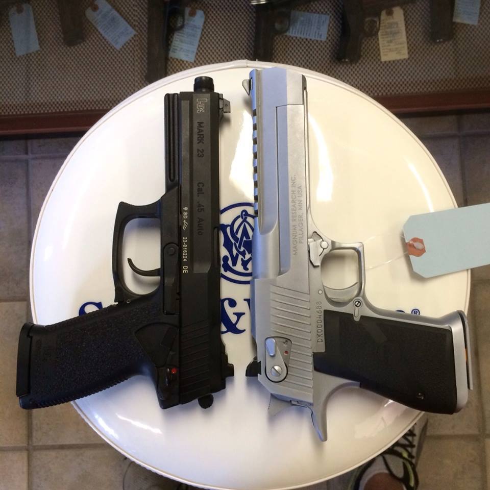 gunrunnerhell:  Size This is actually a good photo illustrating the size of the HK