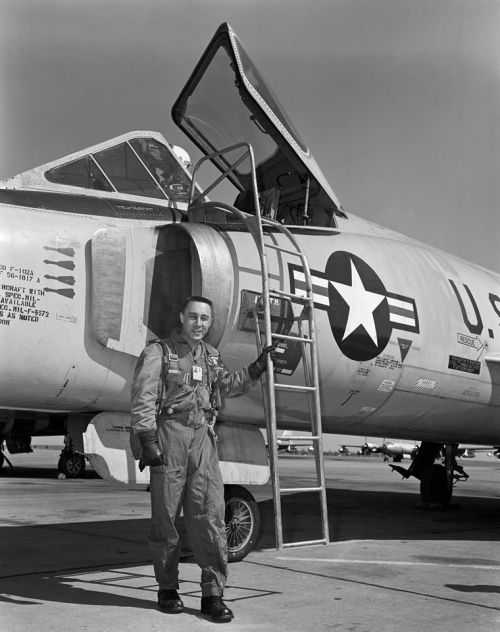 fullafterburner: Gus Grissom next to an F-102.
