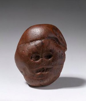 Waterworn pebble resembling a human face, from Makapansgat, South Africa, ca. 3,000,000 BCE. Reddish