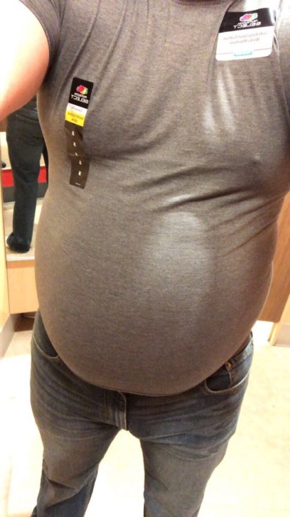 keepembloated: wellfedcollegeguy:  Had some fun in a changing room today. Tried on some 36” jeans and a S shirt (I wear  40” jeans and XL shirts 😂)  It would be fun to watch him squeeze that huge belly into those tight shirts! 