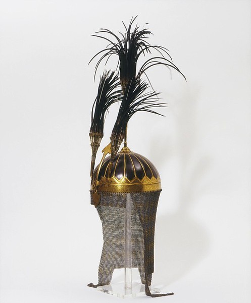 sartorialadventure:Helmet. 1850, Lahore, Pakistan. Steel, brass and gold, with heron feather plumes.