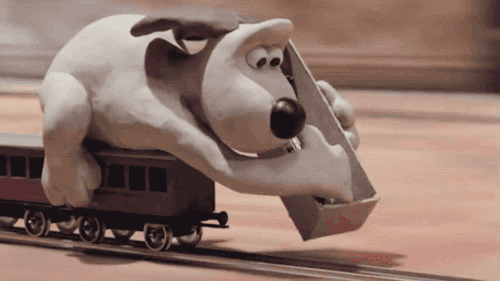 Gromit laying railroad tracks
