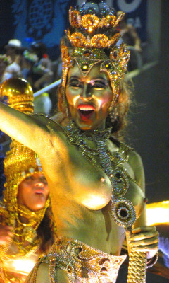 Topless and body painted at a Brazilian carnival,
