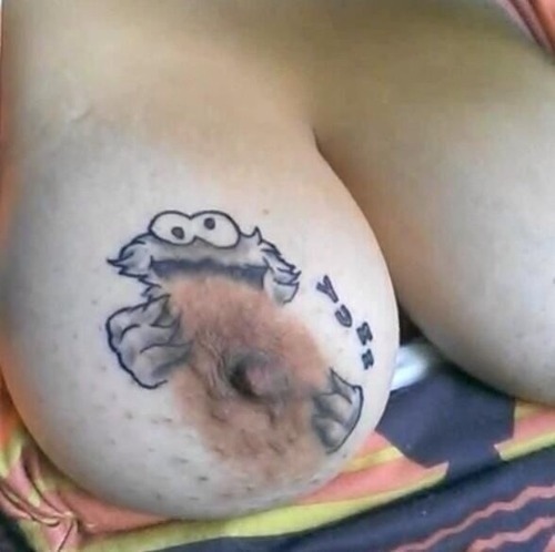 bbcsnake:  deezamm:  kingofthetruth:  Now that’s a tat  Best tit tattoo ever  That’s creatively done○●♤ 