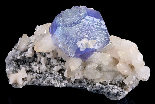 fuckyeahmineralogy:  (via exceptionalroom2) Fluorite on calcite, with small dolomite crystals, from the Shangbao Mine, China 