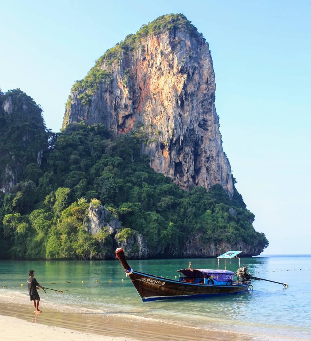 A long-tail boat is being pulled into the shore. It’s the only mode of transport around here, a ride to all nearby islands. The views are nothing short of spectacular but the boatman is almost oblivious to it. He has only one thing on his mind, to...