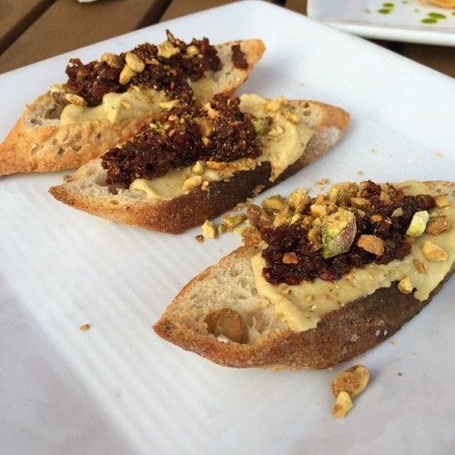 Smoked #cashewcheese on toasted baguette topped with tomato tapenade and crushed pistachios. These w