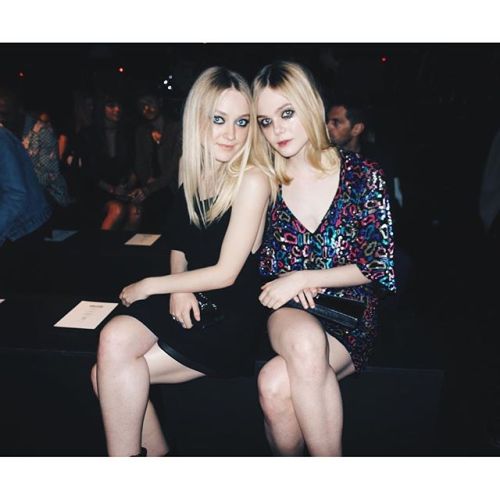  Dakota and Elle Fanning were spotted front row at the Saint Laurent show at the Hollywood Palladium