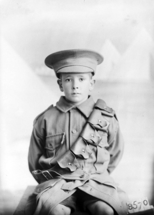 Studio portrait of a child dressed in military uniform, possibly the son of Pte Eldershire.